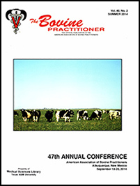 Cover image of Volume 48, No. 1 of the Bovine Practitioner: a herd of Holstein graze languidly on a field and the land stretches away flatly to the horizon where it meets with the bright blue sky.