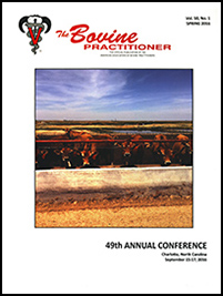 Cover image of Volume 50, No. 1 of the Bovine Practitioner: a herd of Jersey cattle standing in a row looking over the top of a concrete fence, underneath a metal bar