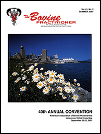 Cover image of Volume 41, No.2 of the Bovine Practitioner: a photo of the Vancouver harbor taken from a nearby hill. The skyline of Vancouver is along the horizon and the foreground is filled by a field of daisies growing among rocks.