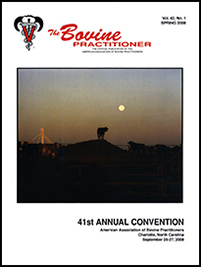 Cover image of Volume 42, No. 1 of the Bovine Practitioner: a photo of a herd of cattle at dusk illuminated slightly by the rising moon, with a mechanical rig in the background. A silhouette of a single cow stands on a hill in the center of the frame.