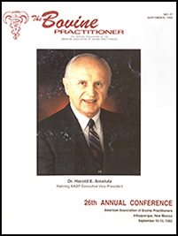 Cover image of the 27th Volume of the Bovine Practitioner: a photo of Dr. Harold E. Amstutz, retirein AABP Executive Vice President. Dr. Amstutz is an elderly white man in a crisp suit and tie, smiling at the camera.