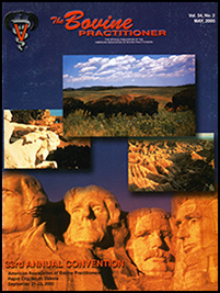 Cover image of Volume 34, no.2 of the Bovine Practitioner: three photographs placed on top of an image of Mt. Rushmore at dawn. From top clockwise the photographs are of a herd of bison grazing on a field, a view of the badlands national park at sunrise, and the statue of Crazy Horse Monument with the view of the unfinished monument in the background