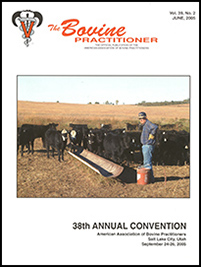 Cover image of Volume 39, No.2 of the Bovine Practitioner: a photo of the man, presumably Dr. Brett A. Gardner, standing by a feed trough with his hands on his hips surrounded by cattle that might be Black Baldies