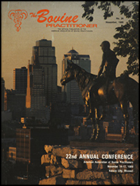 Cover image of the 24th Volume of the Bovine Practitioner: a photo of the Kansas city skyline from the perspective of the Scout--a statue of a Sioux Indian on horseback surveying the landscape