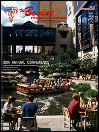 Cover image of the 29th Volume of the Bovine Practitioner: a photo of the San Antonio Riverwalk as seen from a riverside restaurant. Tables of patrons converse and watch a docking riverboat filled with passengers.