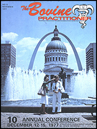 Cover image of the 12th Volume of the Bovine Practitioner: a photo of two women standing in front of the the Old Courthouse which is framed by the St. Louis Arch. The journal title and AABP logo are placed in the upper righthand corner and the 10th annual conference information at the bottom.