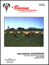 Cover image of Volume 43, No.1 of the Bovine Practitioner: a photo of a herd of Jersey cattle grazing against a picturesque mountain scene