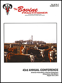 Cover image of Volume 44, No. 2 of the Bovine Practitioner: a photo of a herd of Hereford cattle inquisitively looking at the photographer. In the background, you can see a grain silo and glimpse a farmhouse through the trees.