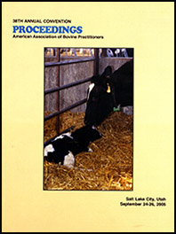 Cover image of the 38th Conference Proceedings: A cow nuzzles her newborn calf in a stall with straw bedding. Both are content. Yellow background.