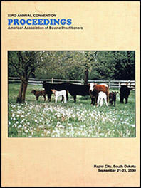 Cover image of the 33rd Conference Proceedings: Cattle and calves standing in a field of wildflowers, gazing curiously at the photographer. Yellow background.